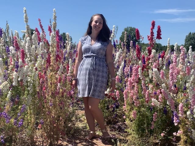 Me in the confetti fields smiling amongst the flowers